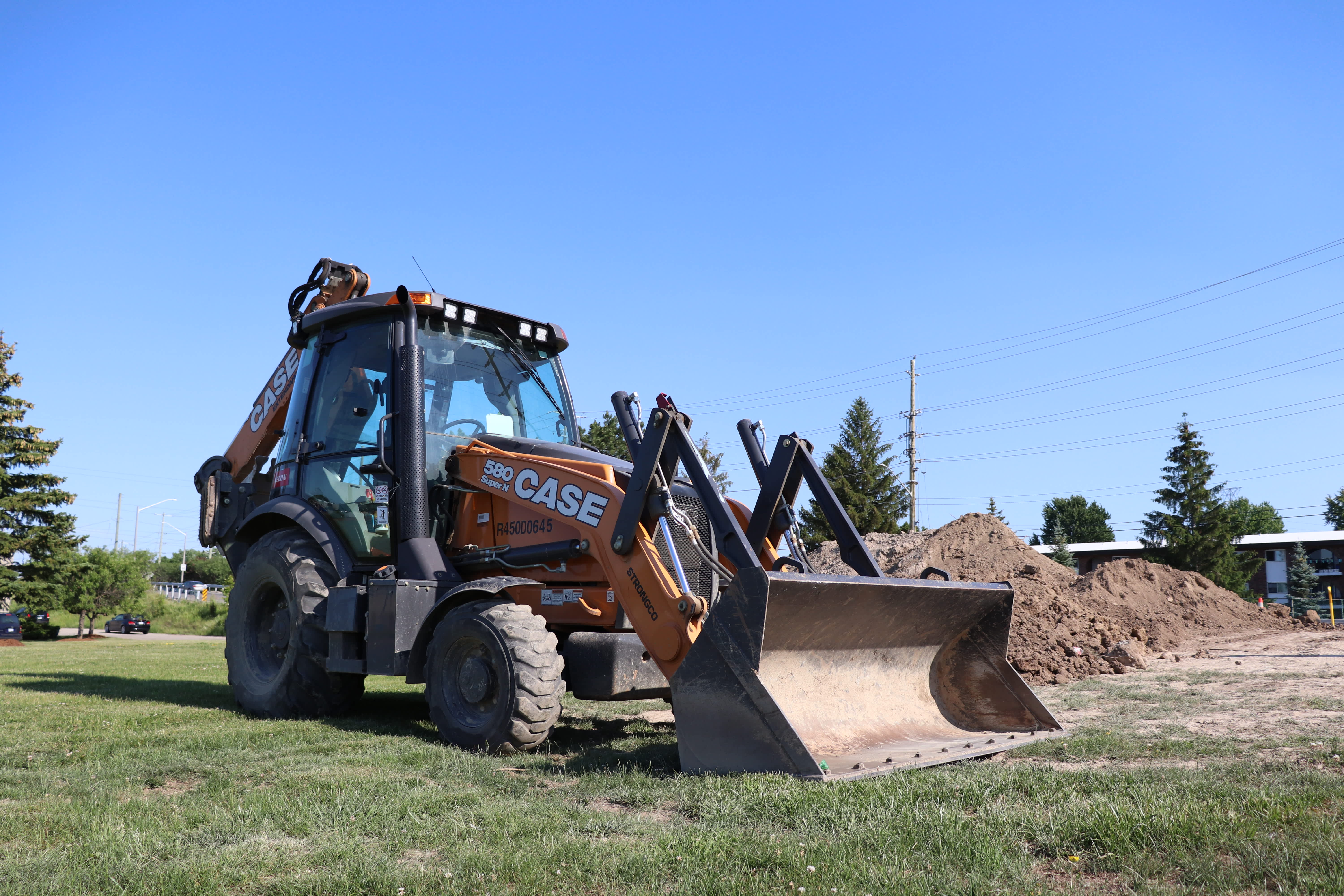 backhoe loader on a construction site parked